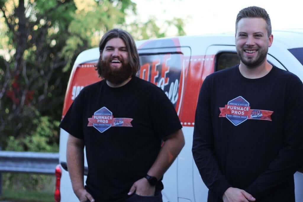 HVAC team standing in front of a truck